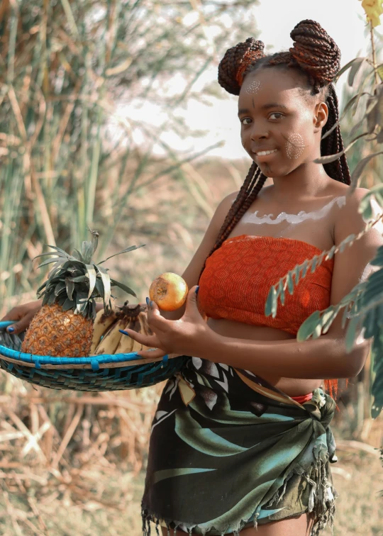 a beautiful young lady in a hula dress holding a tray of fruit