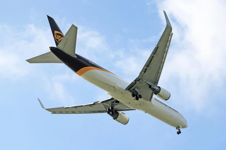 an airplane is flying overhead in a blue sky