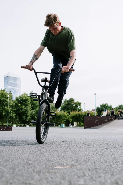 a young man doing a trick on his bike