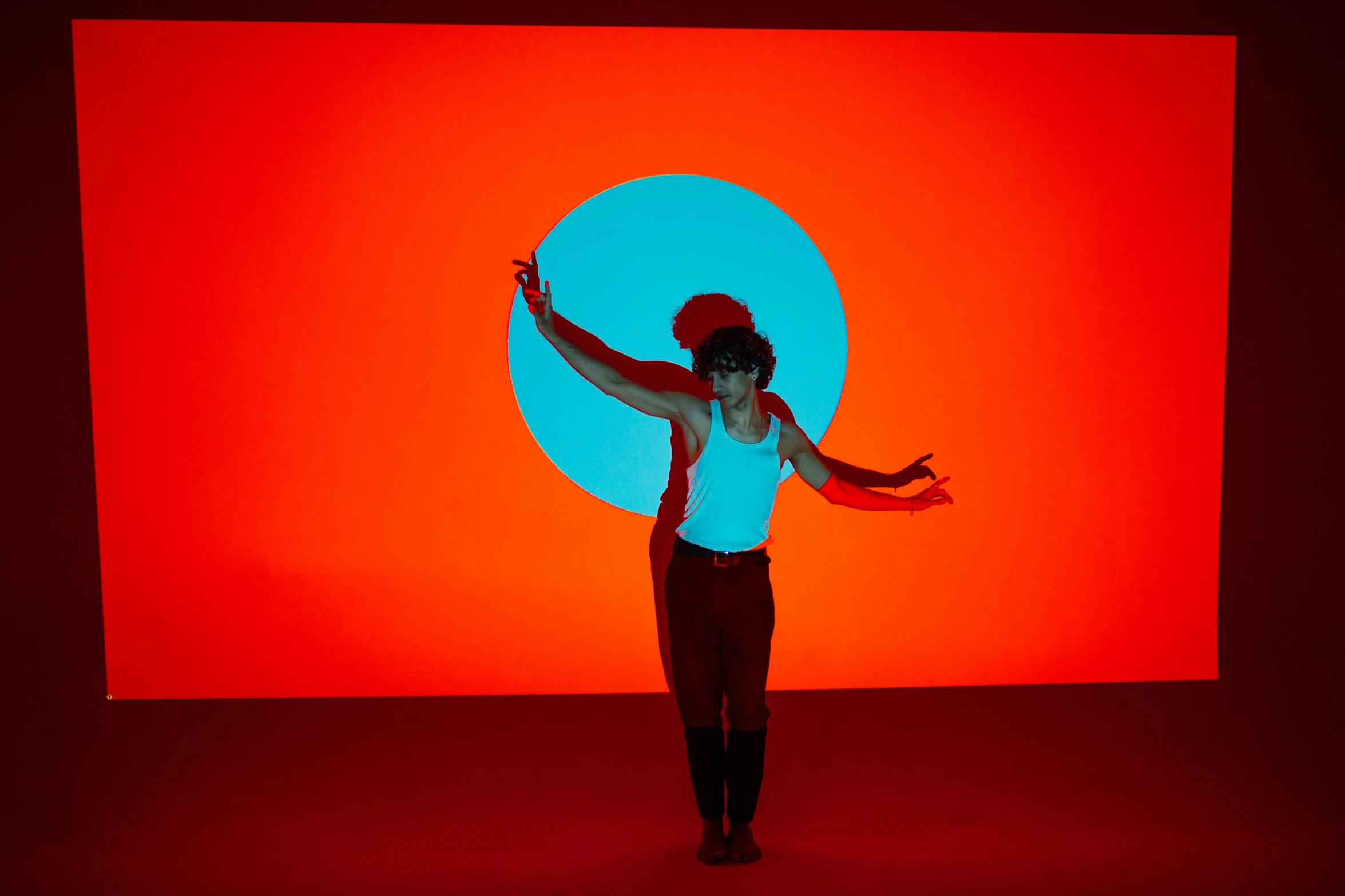 the woman is standing in front of a big display