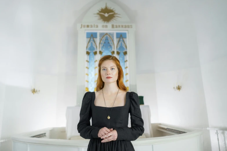 woman standing in front of a very large window