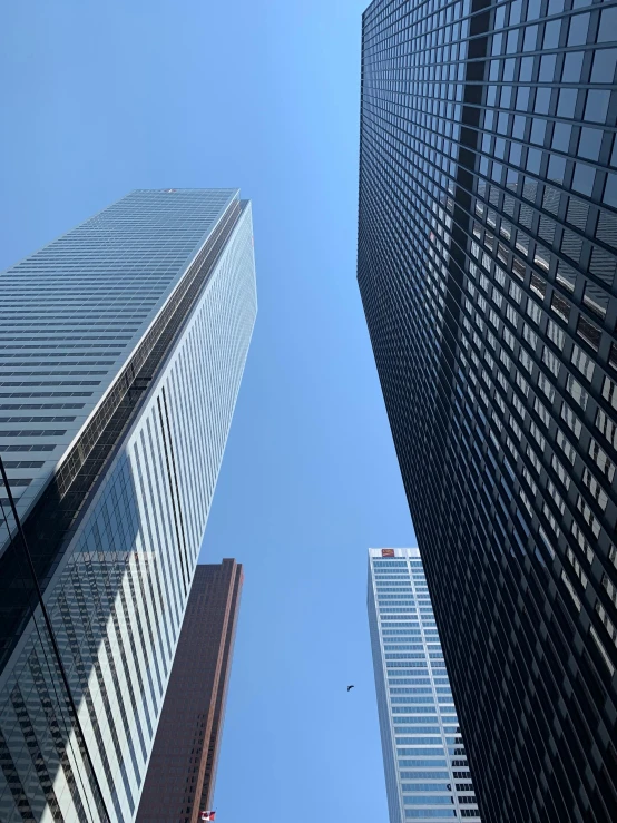 a picture of three skyscrs in the city