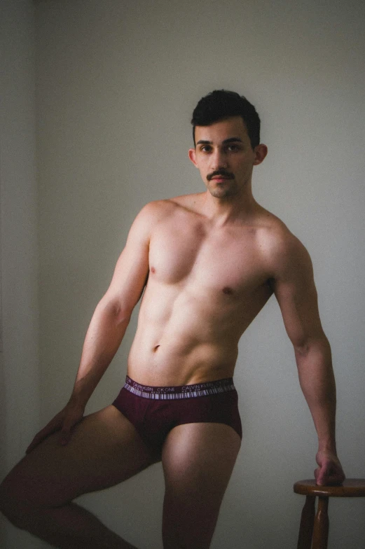 an image of a man in underwear posing