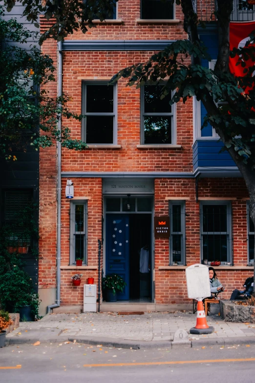 a red brick building with a blue door