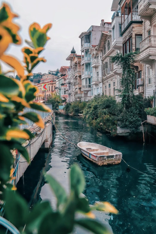 a boat floating in the middle of a waterway