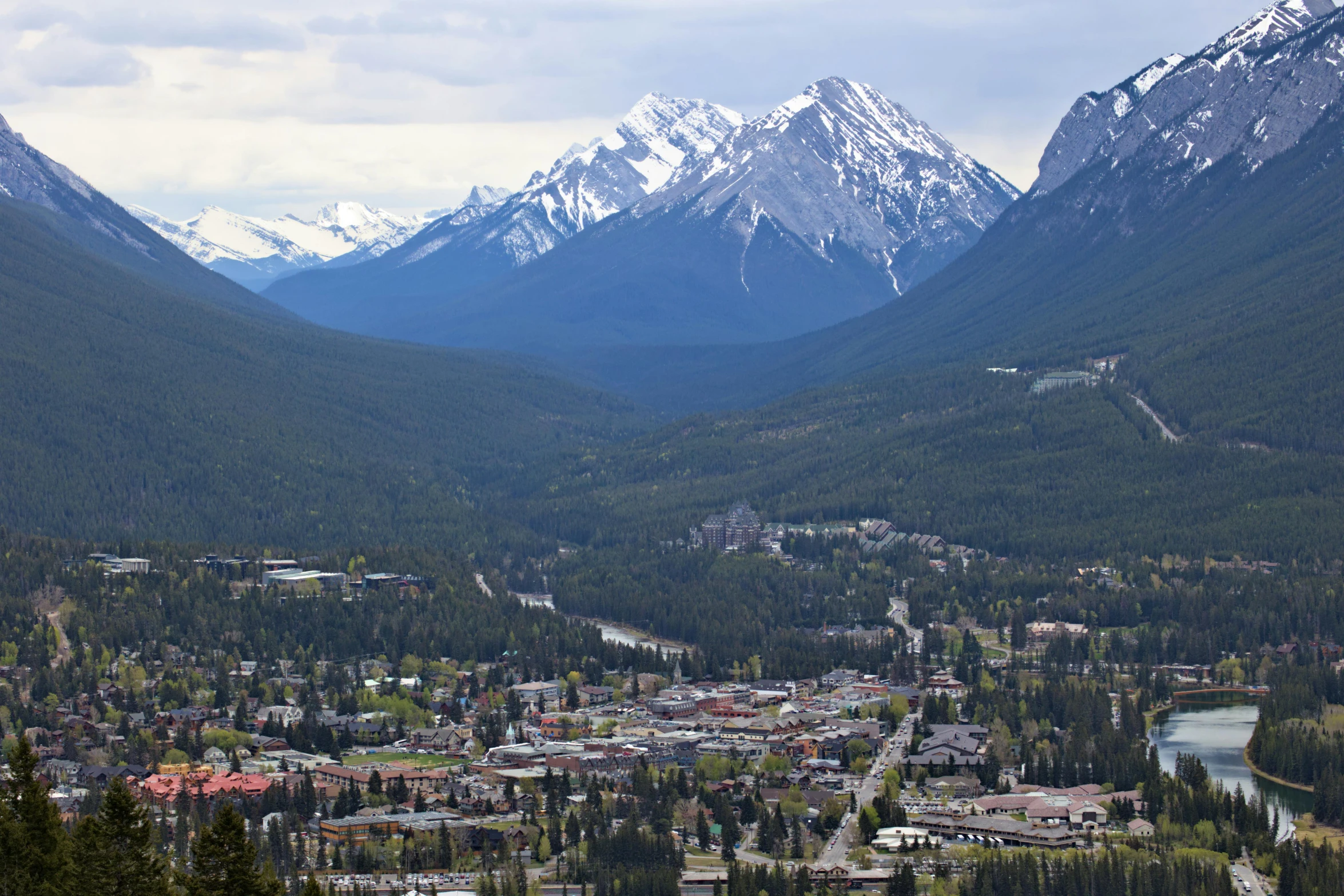 a city in the mountains with the mountains surrounding it