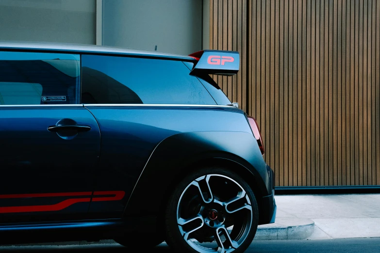 an electric car is parked next to a building