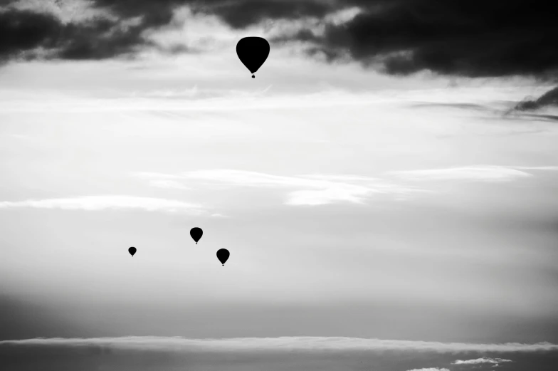 a group of balloons flying through the air