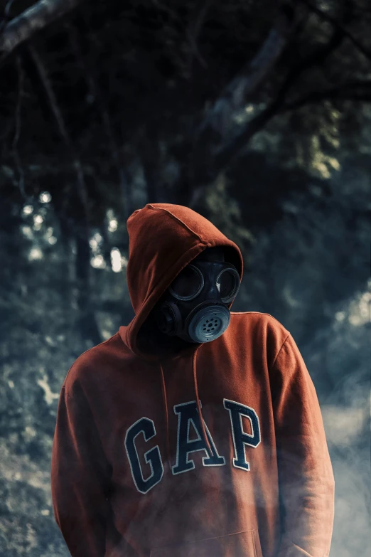 the person in the hoodie wears gas masks