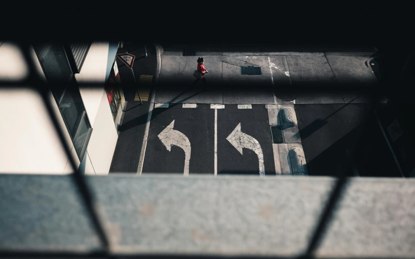 a traffic signal showing lanes on a street from a window