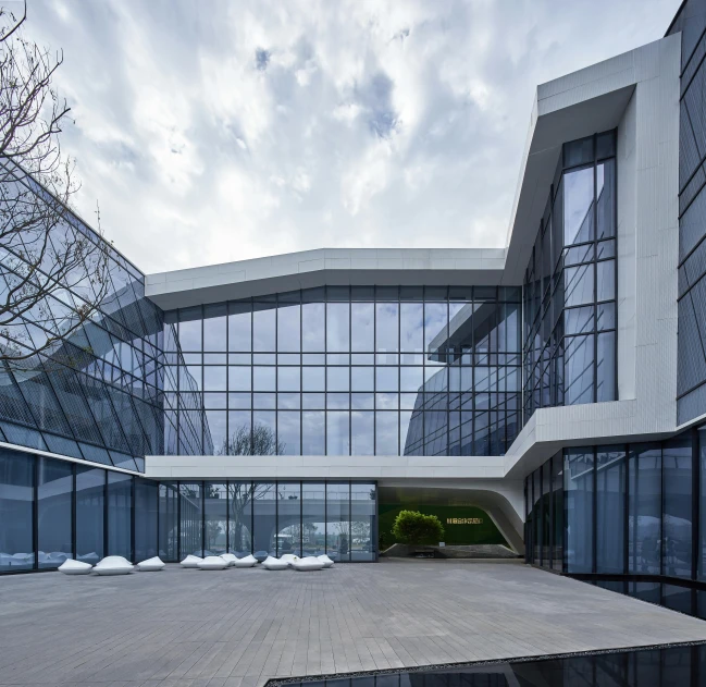 the glass walls and ceiling of an unusual building