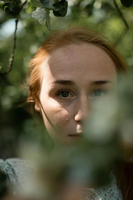 an image of a young woman who is looking down