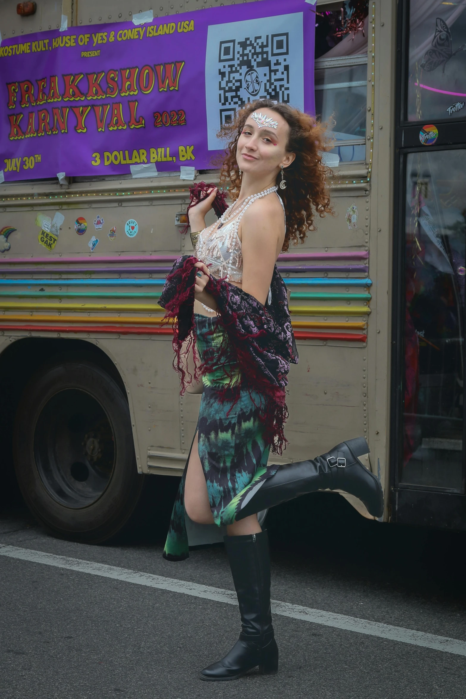 a woman that is standing on the sidewalk