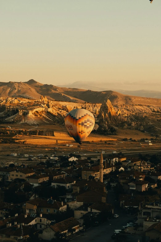 the  air balloons in the shape of people fly above the city