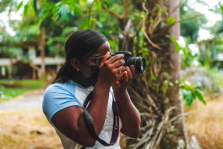 an image of a woman taking a po with her camera