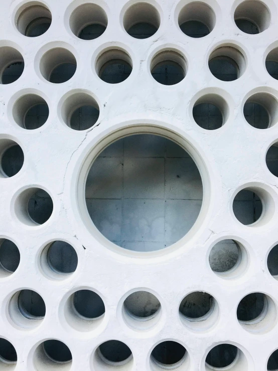 the pattern in a white structure has holes on it