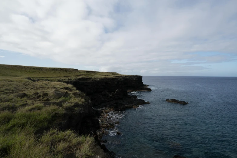 an island on the side of the ocean