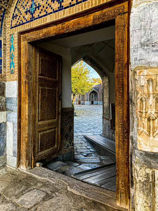 open door with carved wood and tile on side