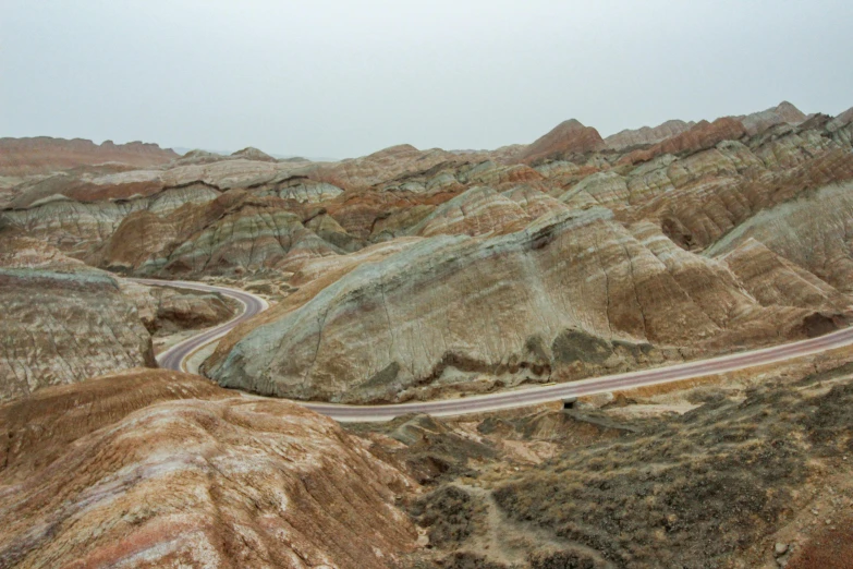 a view of a winding road in a desert