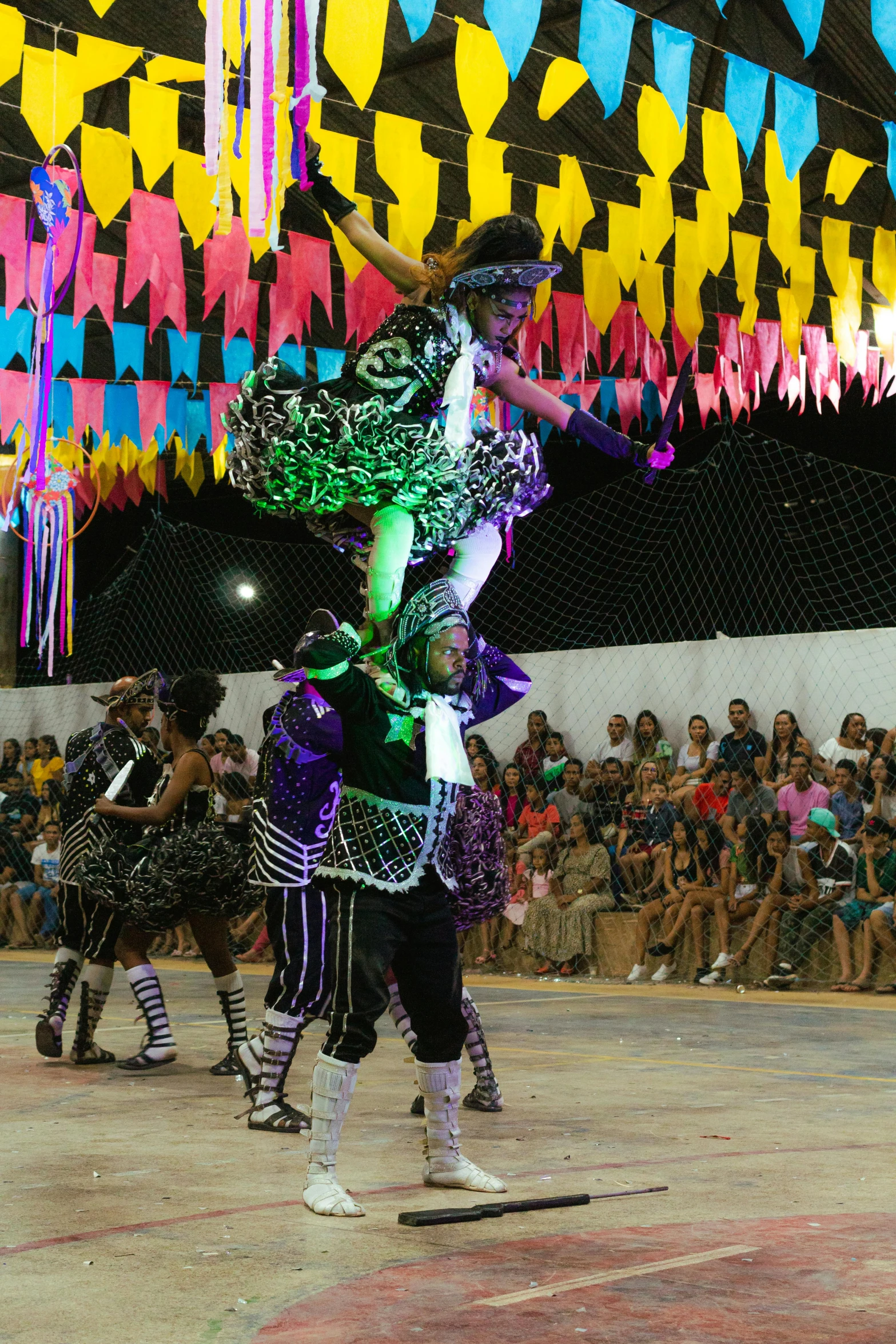 the performers perform in front of a crowd