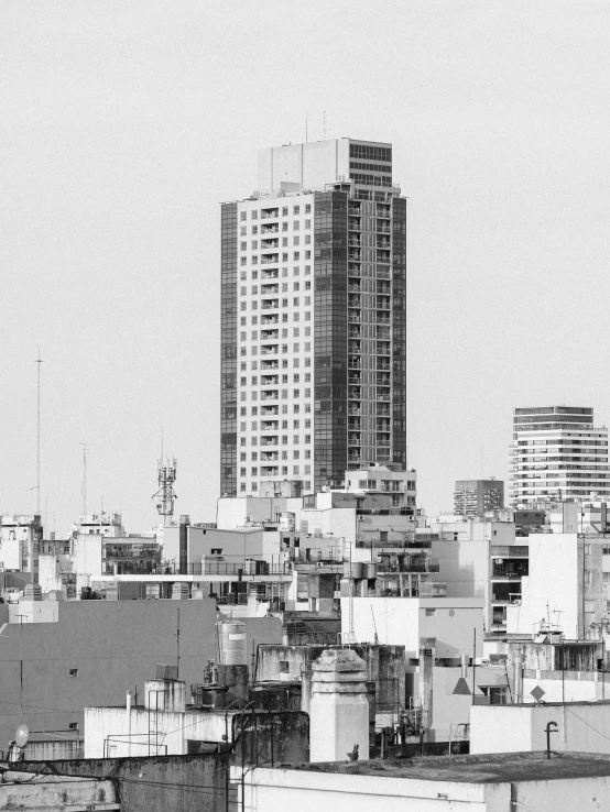 a large tall building sitting over a city