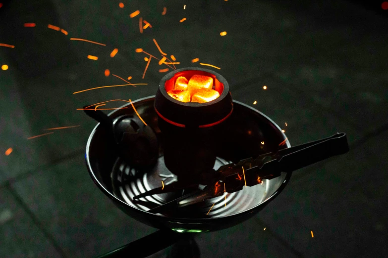 a picture of some food in a metal pot on a grill