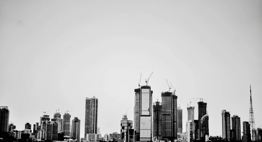 a city skyline of tall buildings and skyscrs