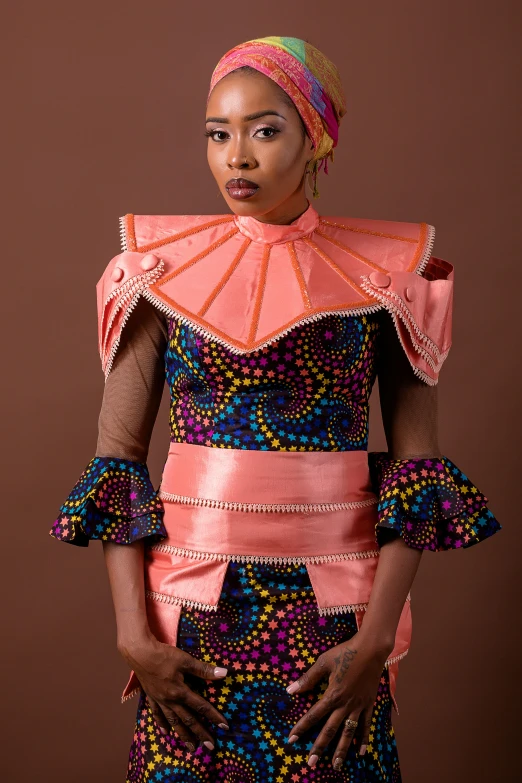 woman in african fashion poses for a po