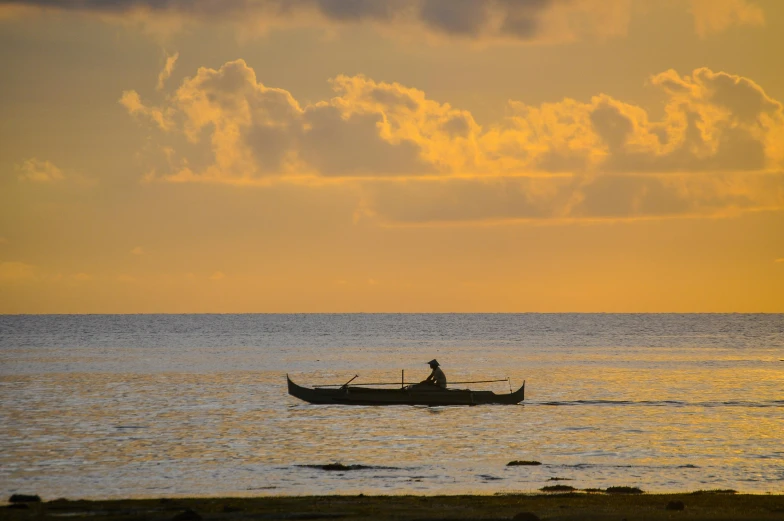 an image of two people riding on the boat in the water