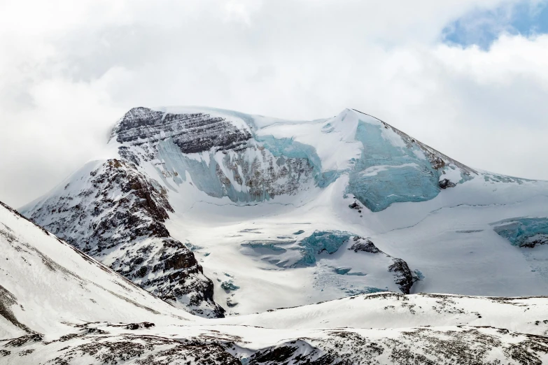 a mountain that has some snow on it