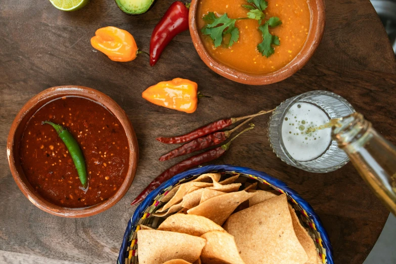 bowls of colorful food are on top of a table