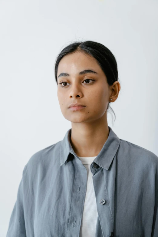 a young woman with a dark, messy hair