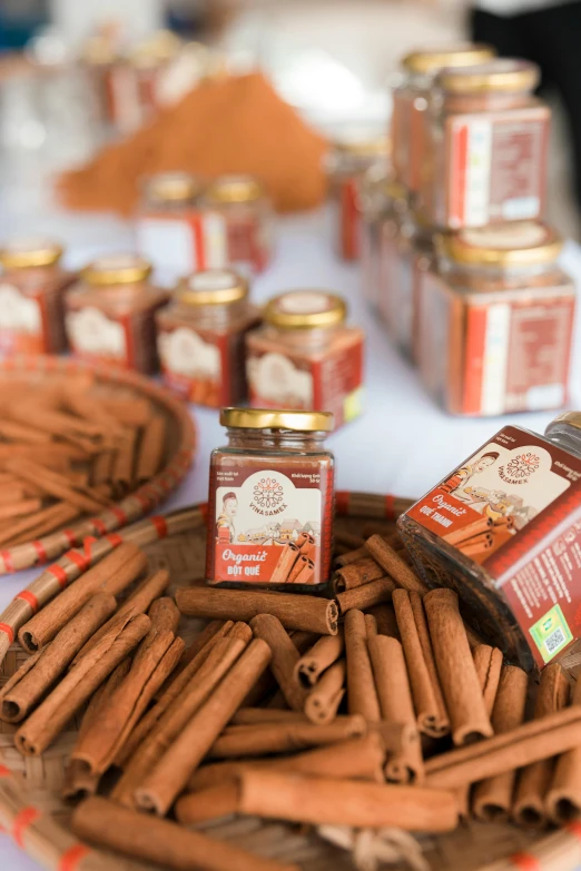 cinnamon sticks and spice jars on a table