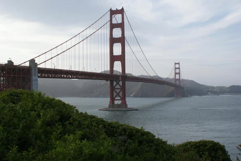 the golden gate bridge is seen from across the water