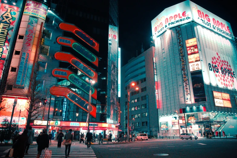 a large red lit building in a city