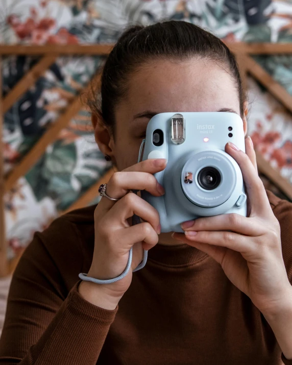 a woman taking a po with a camera