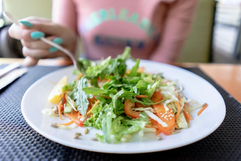 the salad is on the plate ready to be eaten