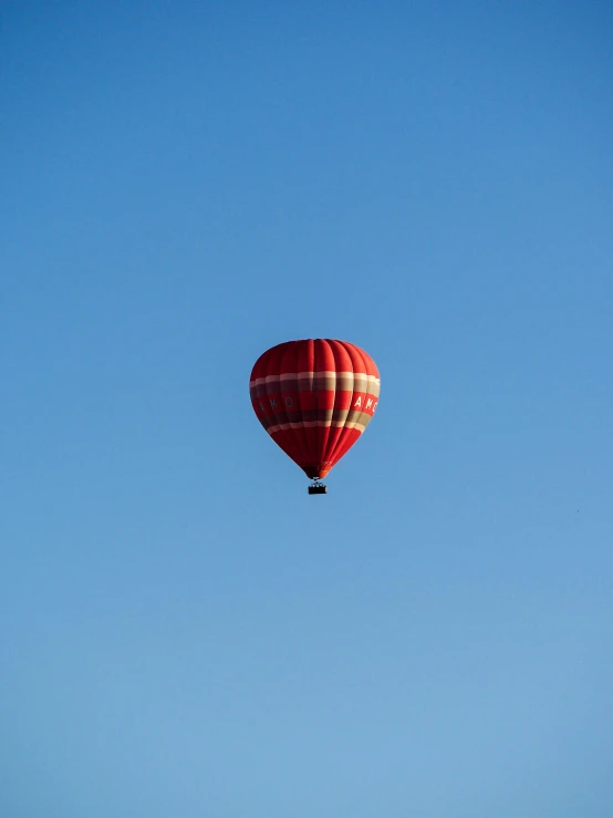 a  air balloon floating high in the sky