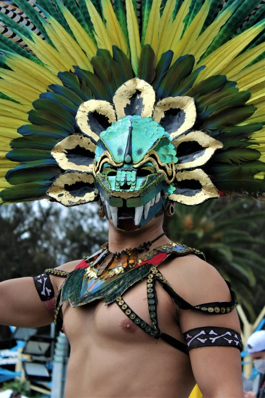 a man in costume holding soing in his hands