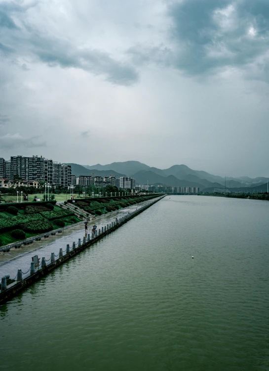 a body of water with buildings in the distance