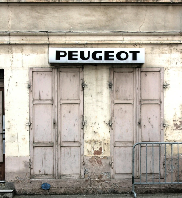 a wooden doorway on the side of a rundown building