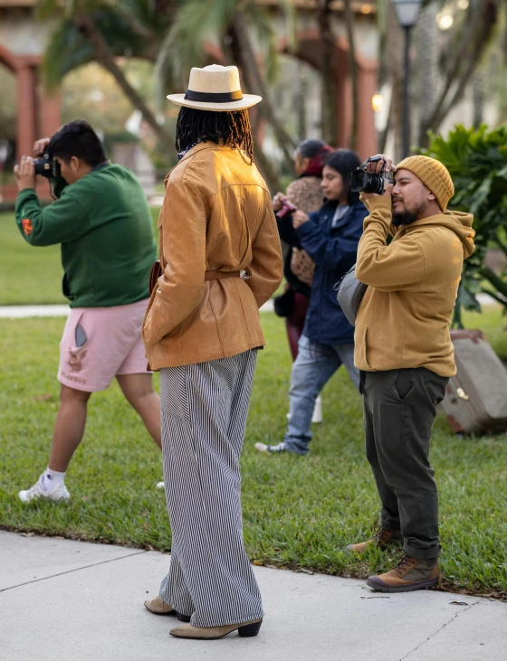 two men are looking through binoculars to see soing in the distance