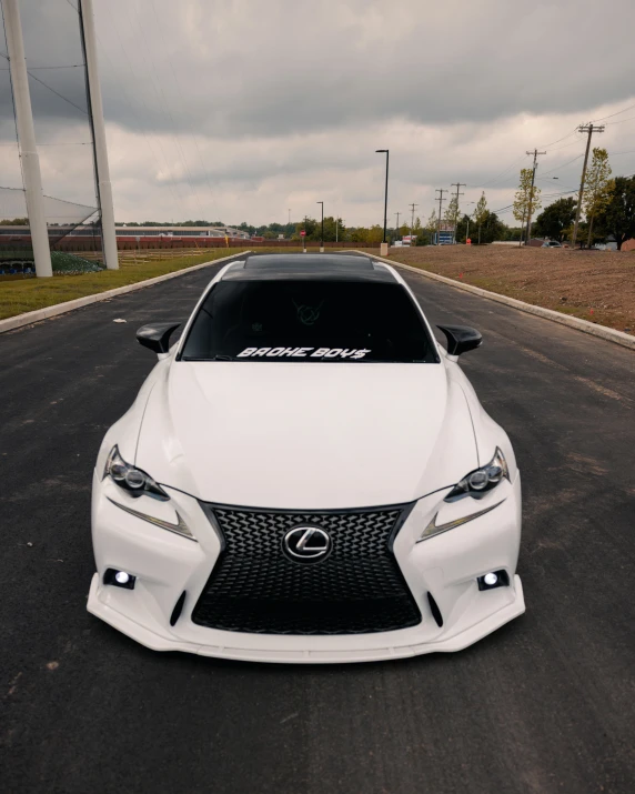 a white sports car is on the road