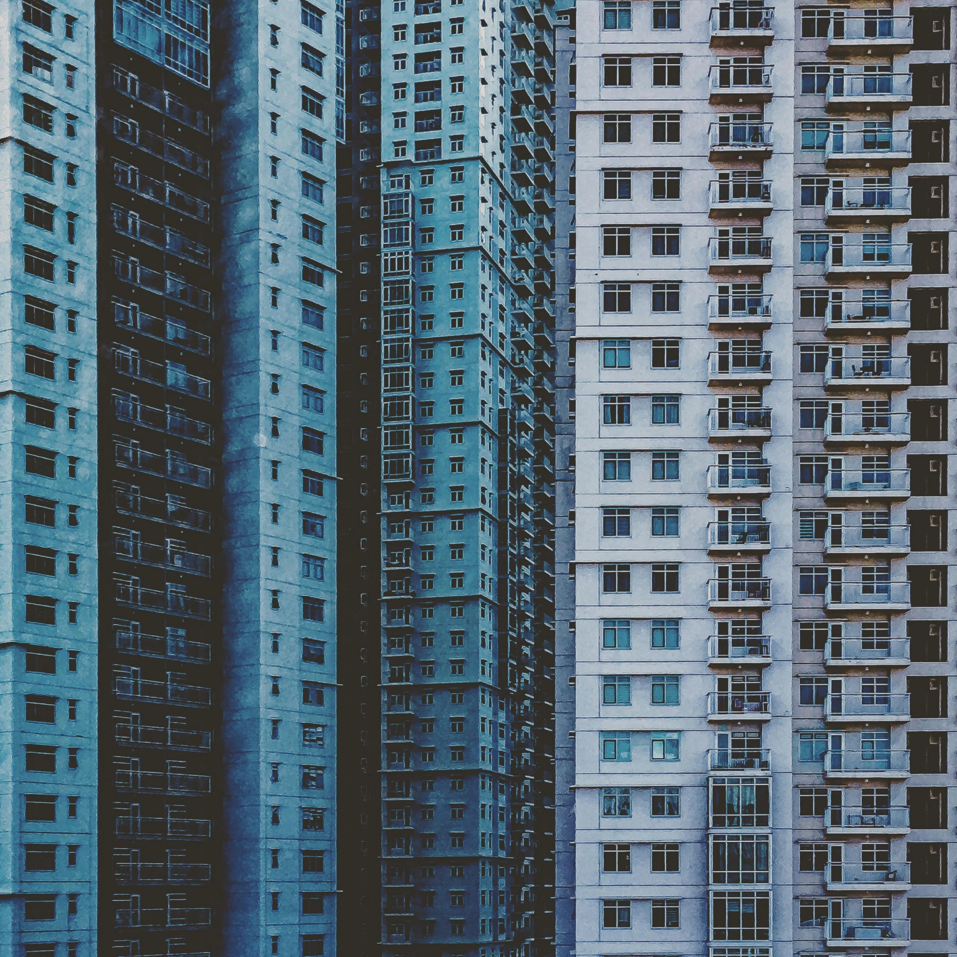 several different colored buildings that appear to have glass doors