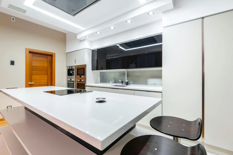 an empty kitchen counter sits in the middle of the room