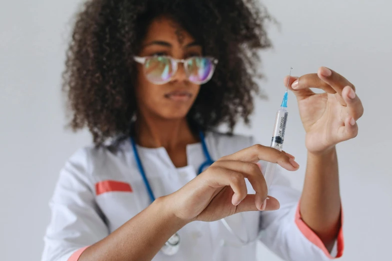 a person holding a medical syula in her hand