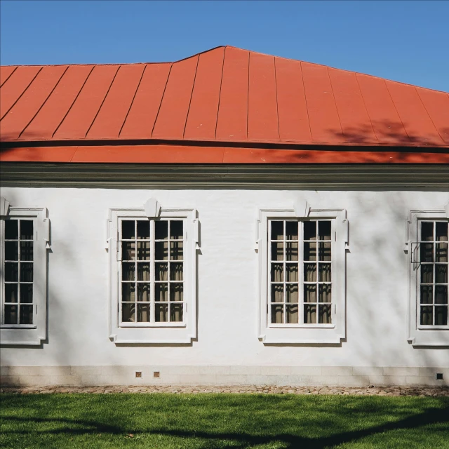 a po of windows on a white building