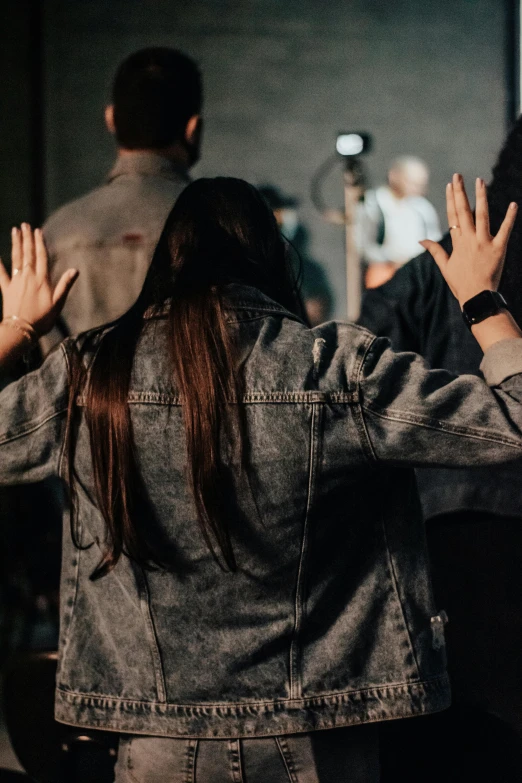 people standing around with their arms stretched out