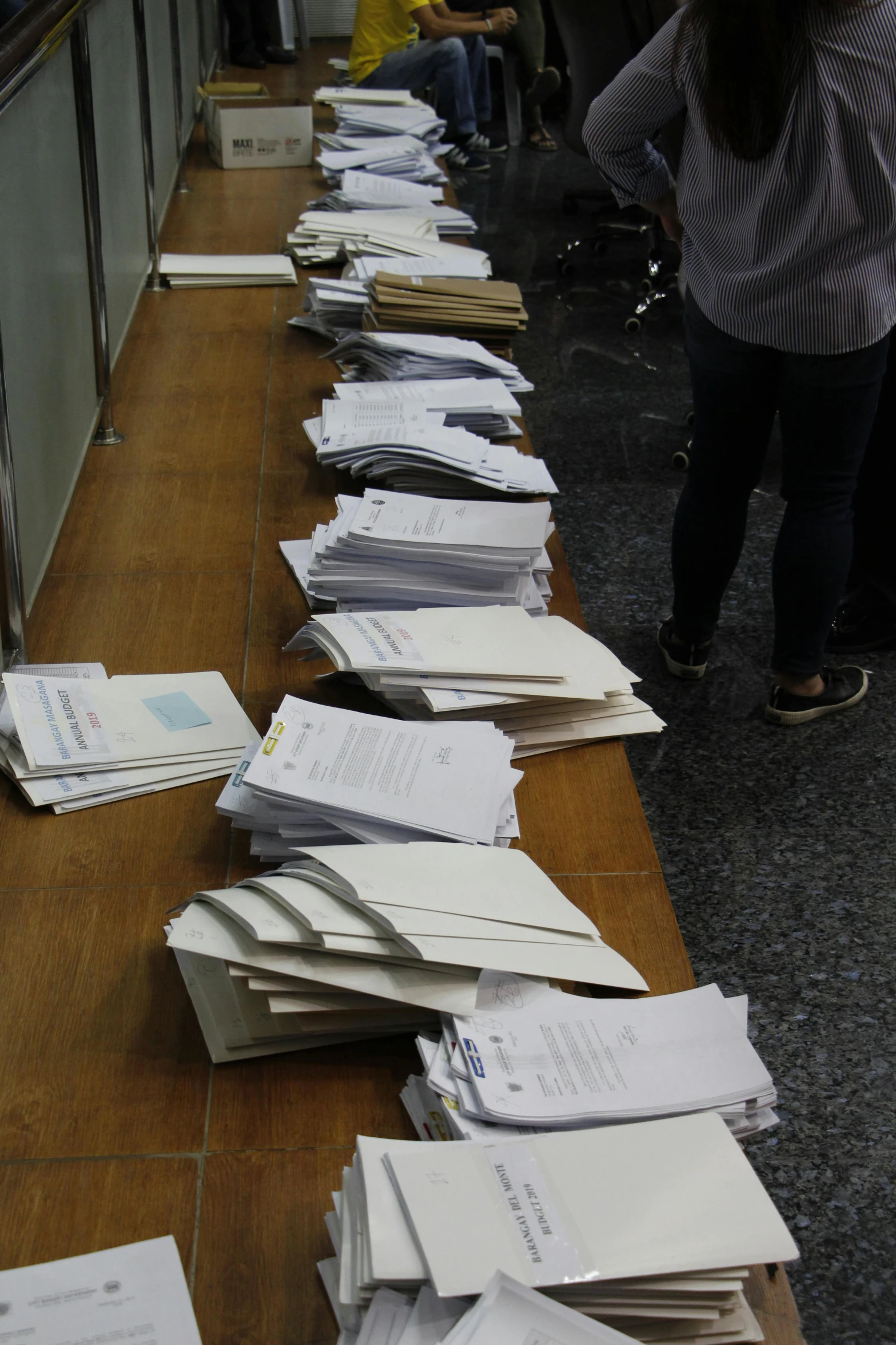 many files of papers are lined up on the counter