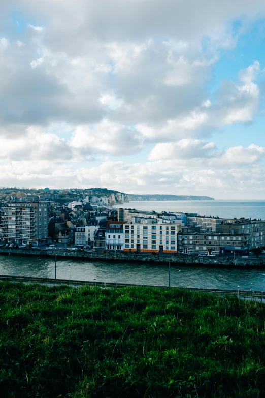 the view of a city and the water from a hill